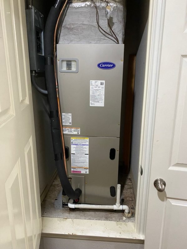 New Carrier air handler installed in a utility closet
